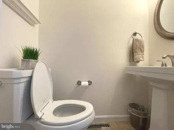 a bathroom with a toilet and a sink