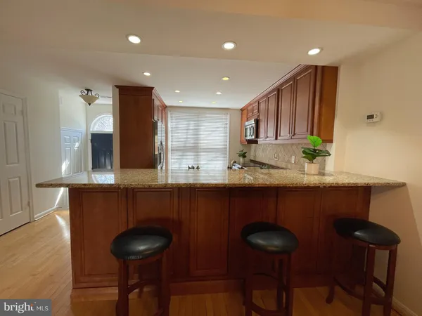 a kitchen with a sink cabinets and window