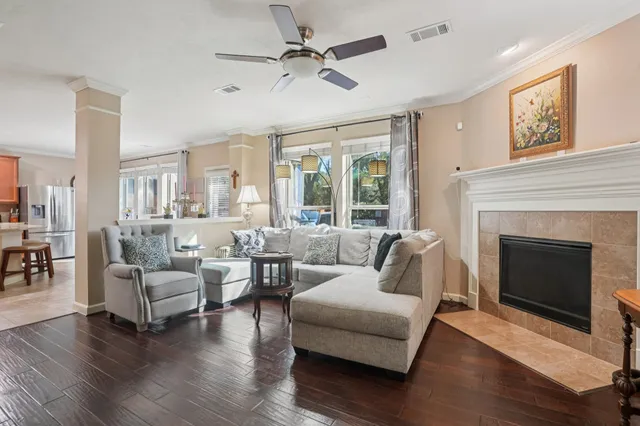 a living room with furniture and a fireplace