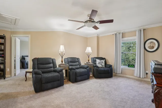 a living room with furniture and a window
