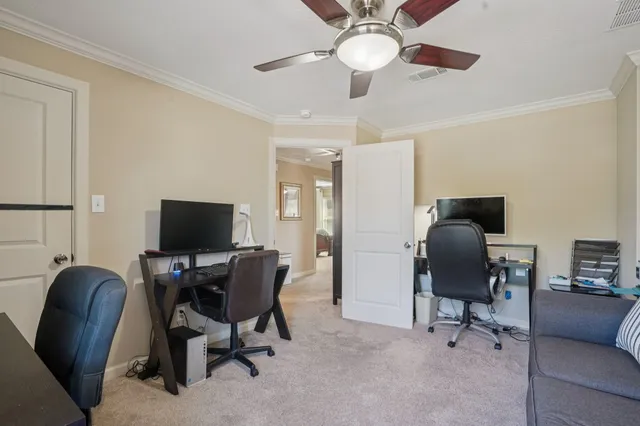 a view of a livingroom with workspace and a couch