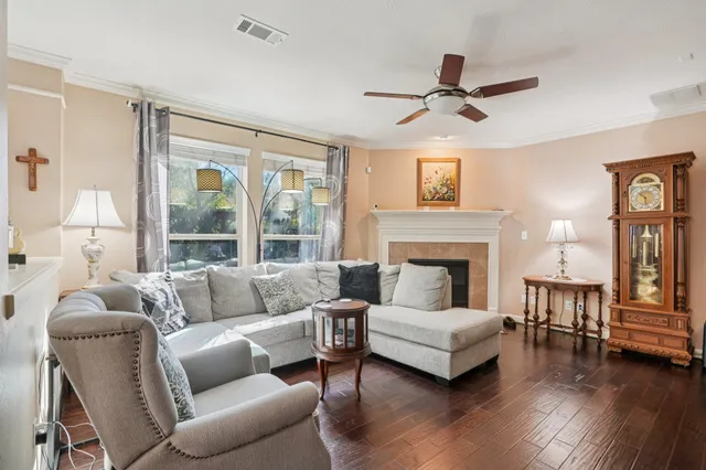 a living room with furniture and a fireplace