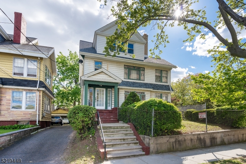 a view of a house with a garden
