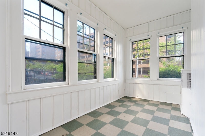 148 Lyons Avenue, Unit 1 Newark, NJ 07112 - Photo 3 of 9 a view of an empty room with a window