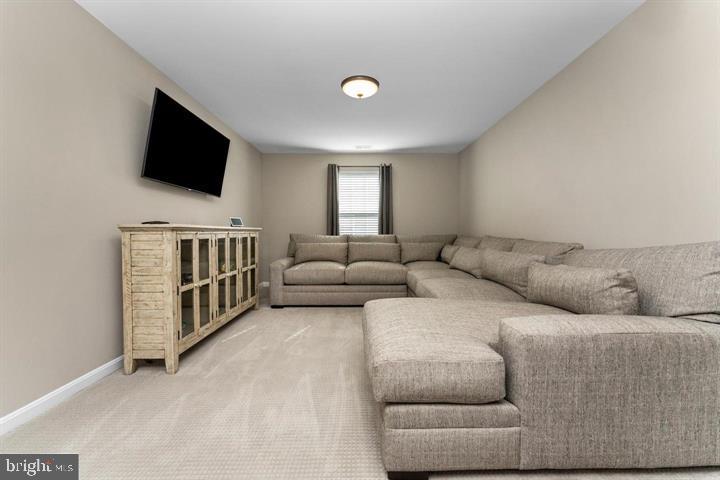 702 Kingsbrook Road Culpeper, VA 22701 - Photo 11 of 35 a living room with furniture and a flat screen tv