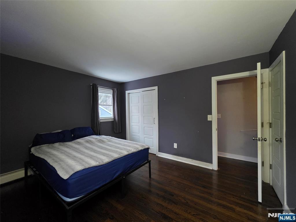 12 Augusta Street Denville, NJ 07834 - Photo 11 of 24 a bedroom with a bed and wooden floor