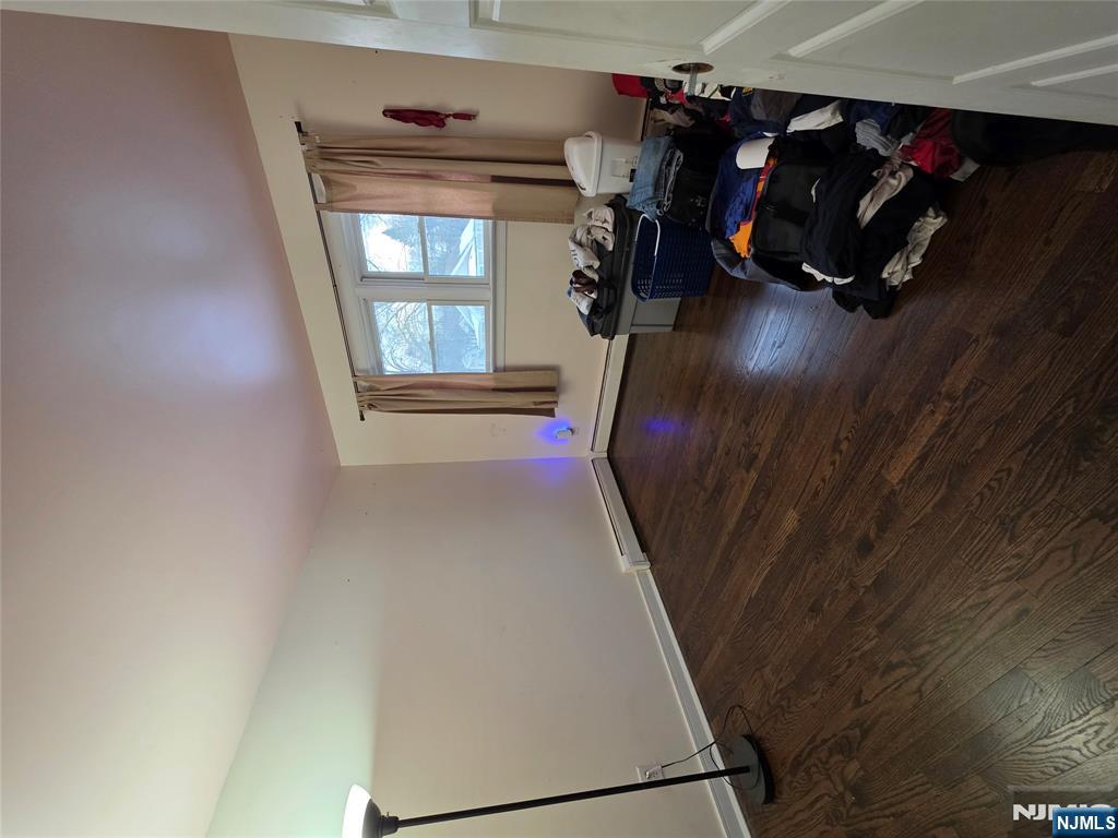 12 Augusta Street Denville, NJ 07834 - Photo 13 of 24 a room with wooden floor and gym equipment