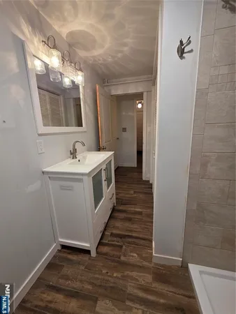 a bathroom with sink and mirror