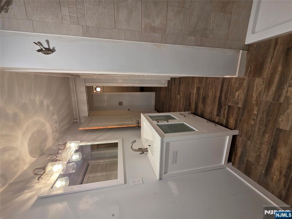 12 Augusta Street Denville, NJ 07834 - Photo 18 of 24 a bathroom with sink and mirror