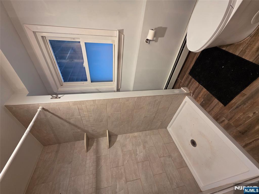 12 Augusta Street Denville, NJ 07834 - Photo 19 of 24 a bathroom with a toilet and a shower