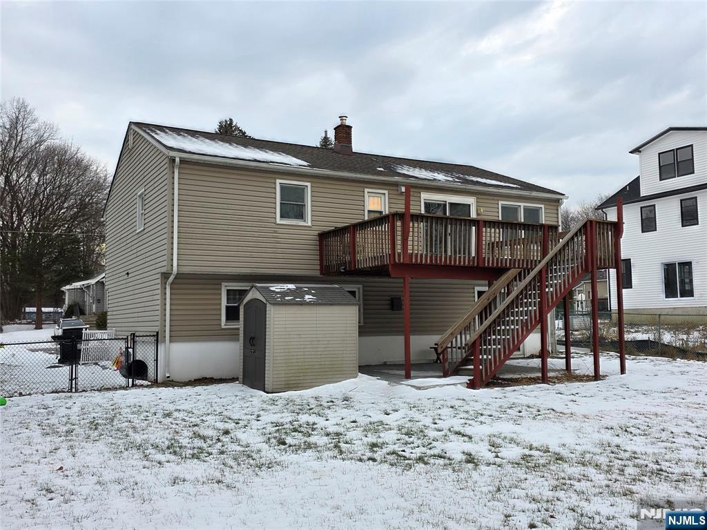 12 Augusta Street Denville, NJ 07834 - Photo 23 of 24 a front view of a house with a wooden deck
