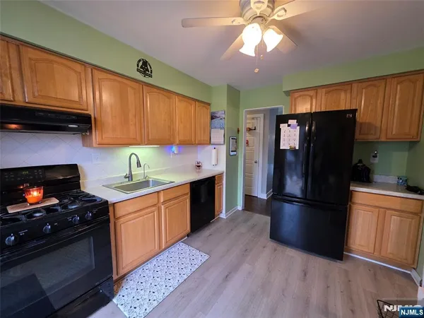 a kitchen with a refrigerator stove and microwave