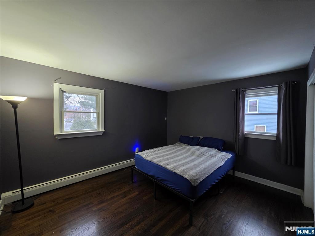 12 Augusta Street Denville, NJ 07834 - Photo 10 of 24 a wooden bench sitting in a bedroom next to a window
