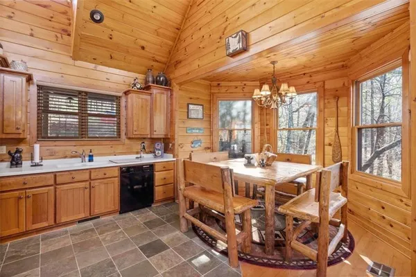 a kitchen with stainless steel appliances granite countertop a sink and cabinets