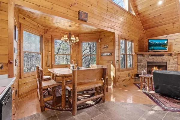 a view of a dining room with furniture window and outside view