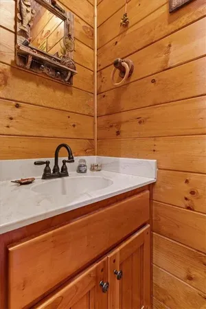 a bedroom with furniture and large window