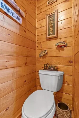 a bedroom with furniture and a flat screen tv