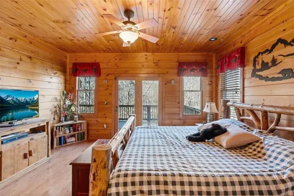 a bathroom with a granite countertop sink mirror and shower