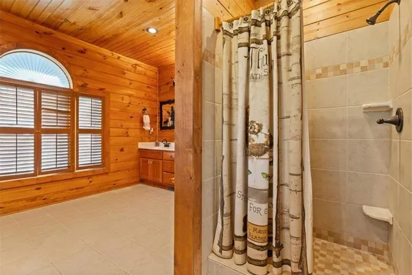 a view of a bathroom with a sink and a window