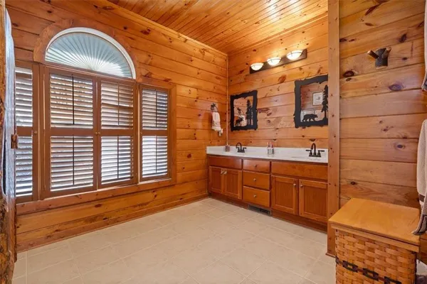 a view of a shower and chair in the room