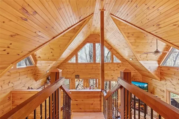 a living room with a couch and wooden floor