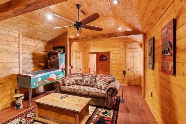 a view of a porch with wooden floor and fence