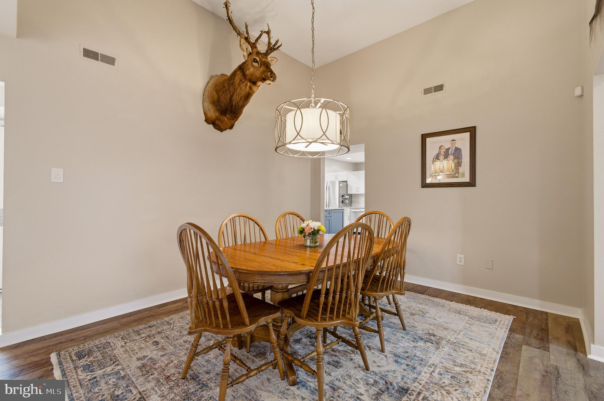 1410 Knights Bridge Turn Crofton, MD 21114 - Photo 17 of 75 a dining room with a table and chairs
