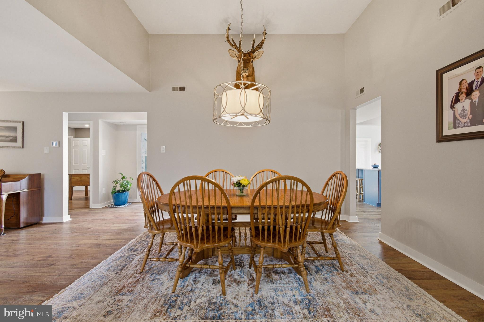 1410 Knights Bridge Turn Crofton, MD 21114 - Photo 18 of 75 a view of a dining room with furniture window and wooden floor