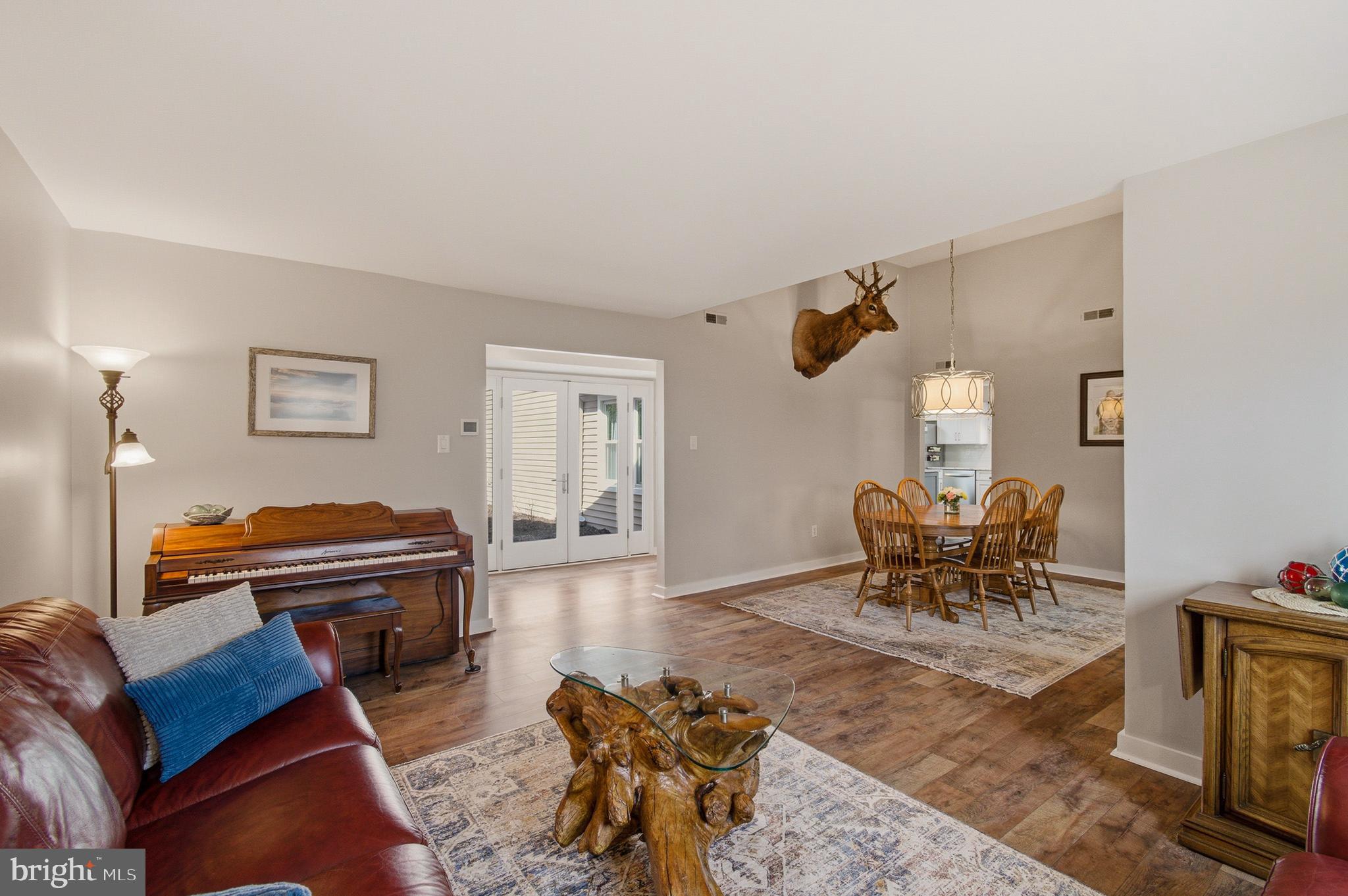 1410 Knights Bridge Turn Crofton, MD 21114 - Photo 25 of 75 a living room with furniture piano and a piano