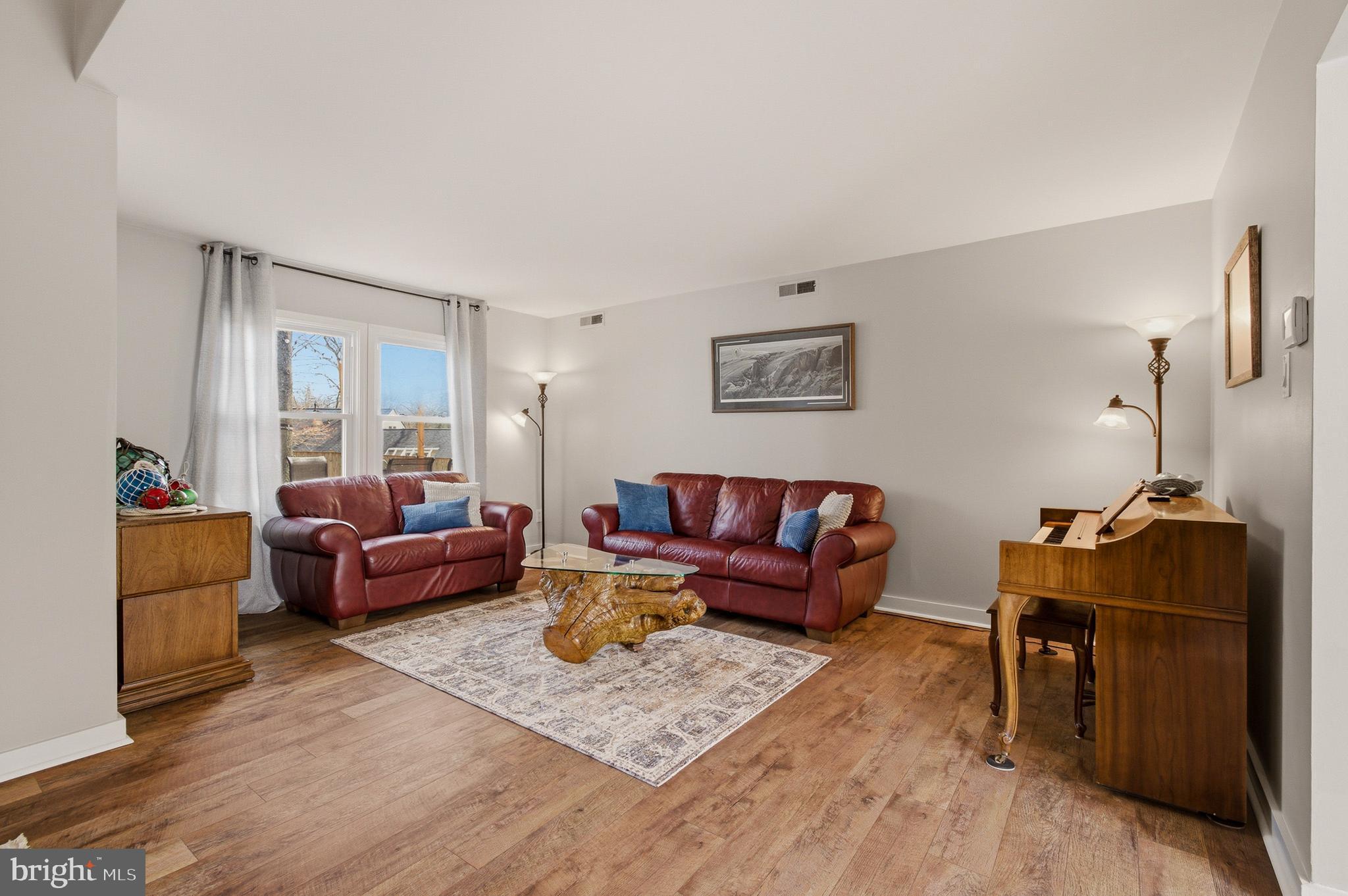 1410 Knights Bridge Turn Crofton, MD 21114 - Photo 27 of 75 a living room with furniture and a window