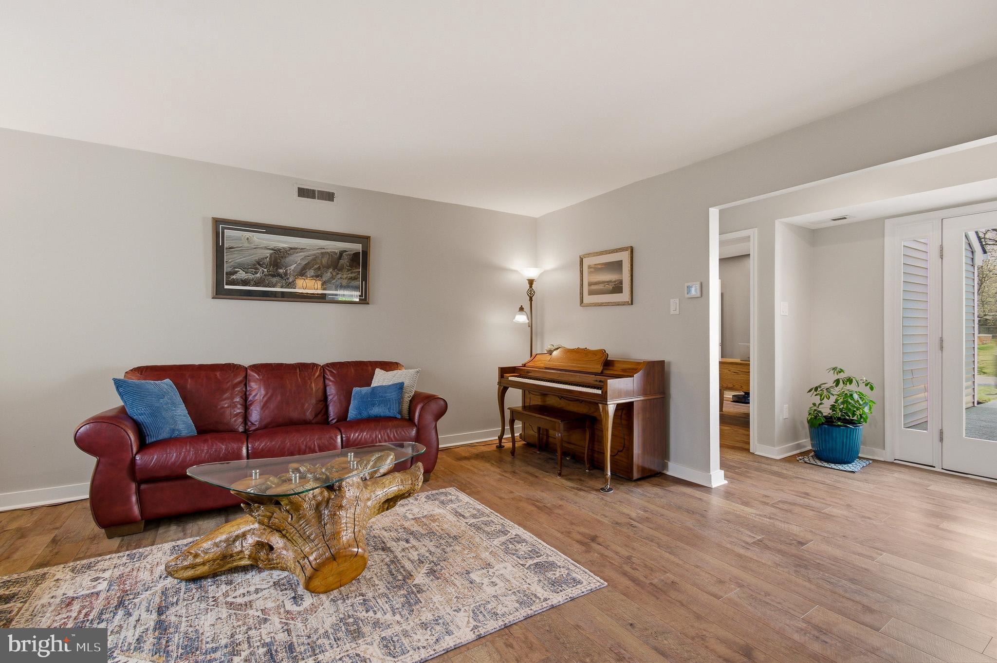 1410 Knights Bridge Turn Crofton, MD 21114 - Photo 28 of 75 a living room with furniture a piano and a window