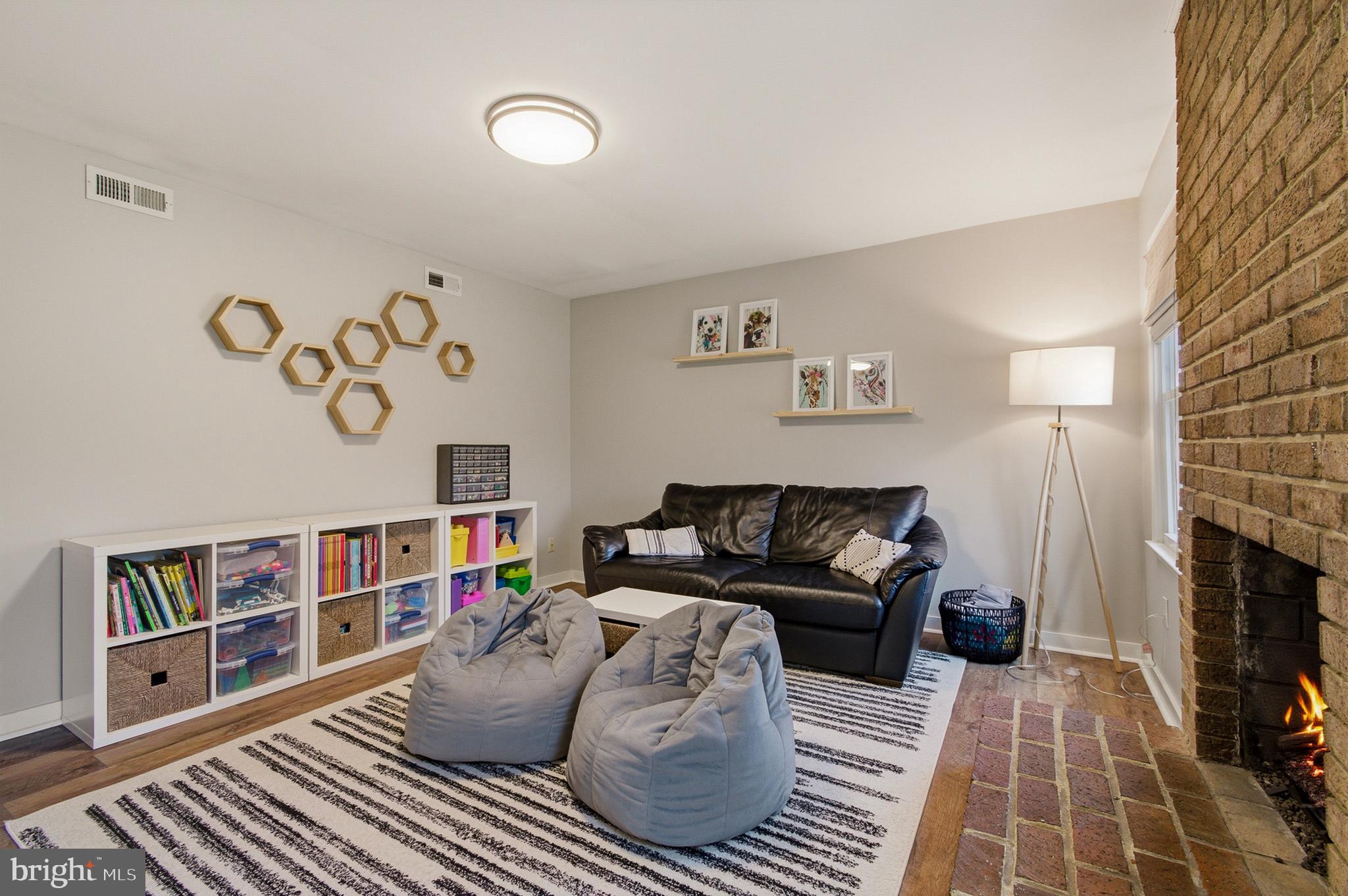 1410 Knights Bridge Turn Crofton, MD 21114 - Photo 29 of 75 a living room with furniture and a fireplace