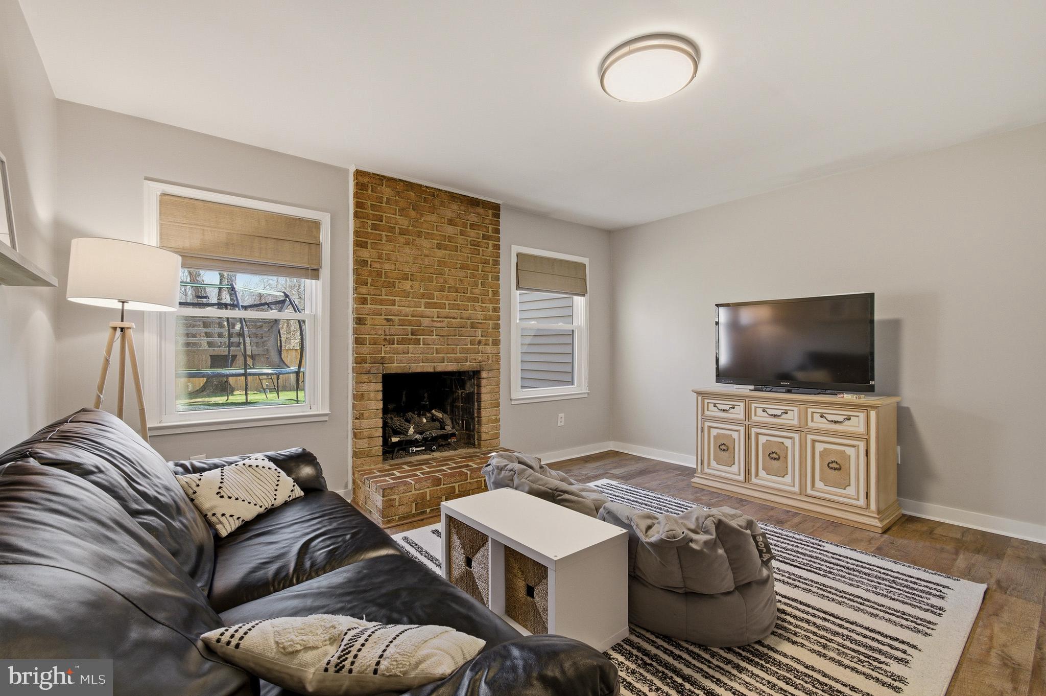 1410 Knights Bridge Turn Crofton, MD 21114 - Photo 30 of 75 a living room with furniture and a flat screen tv