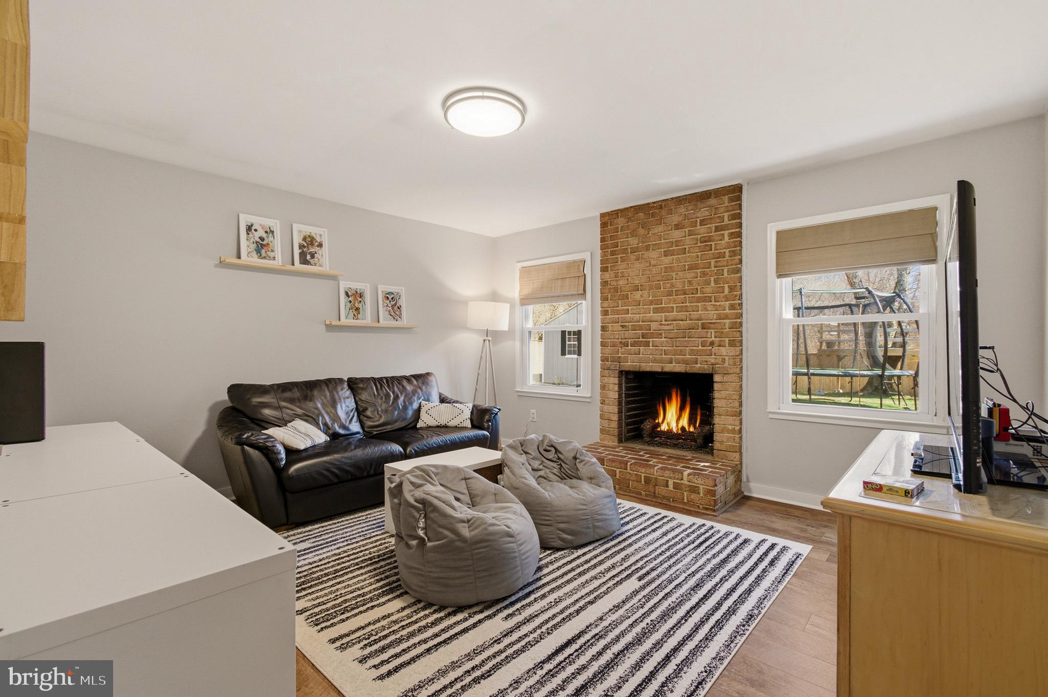 1410 Knights Bridge Turn Crofton, MD 21114 - Photo 31 of 75 a living room with furniture and a fireplace
