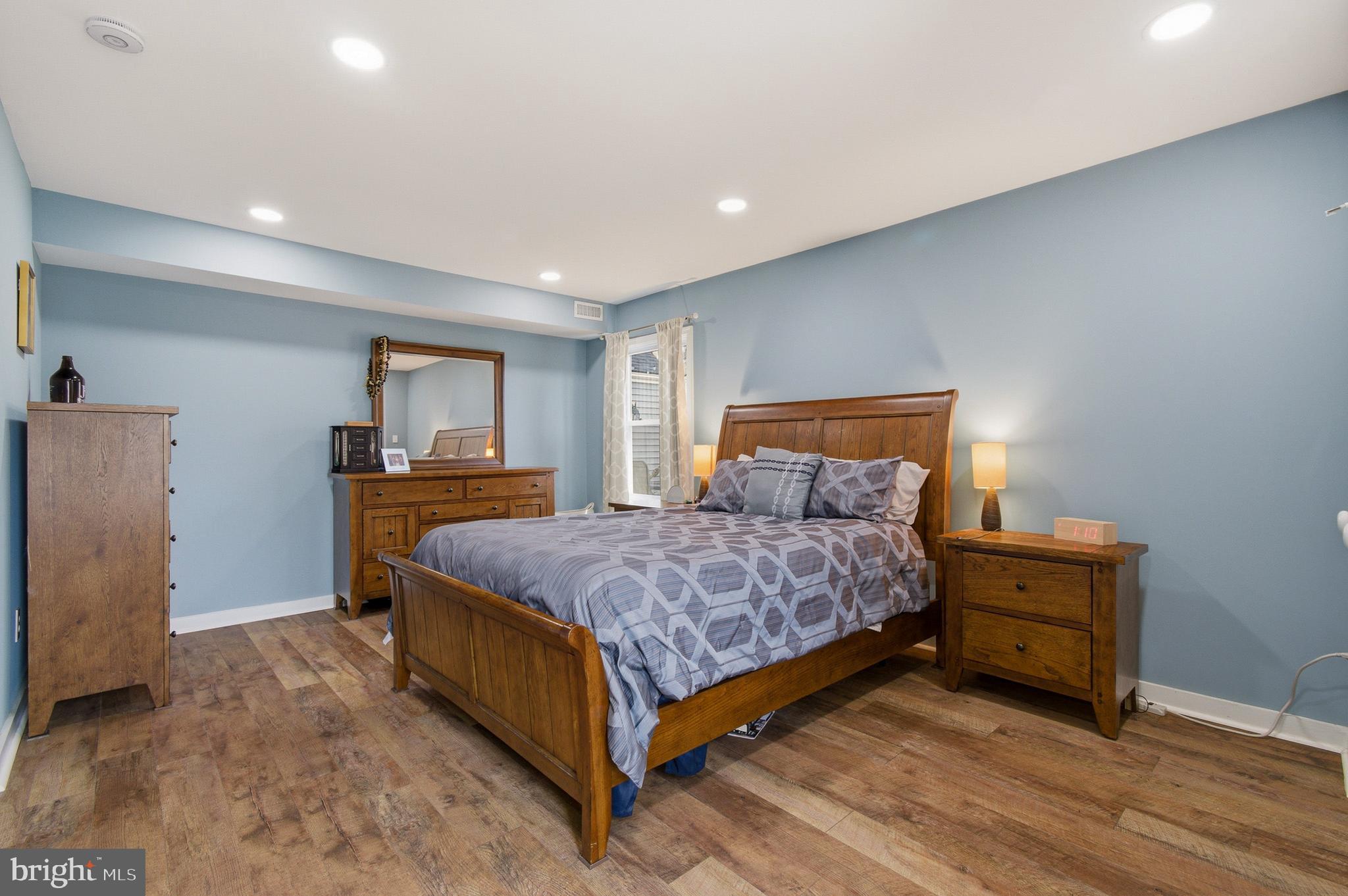 1410 Knights Bridge Turn Crofton, MD 21114 - Photo 32 of 75 a bedroom with a bed and a dresser