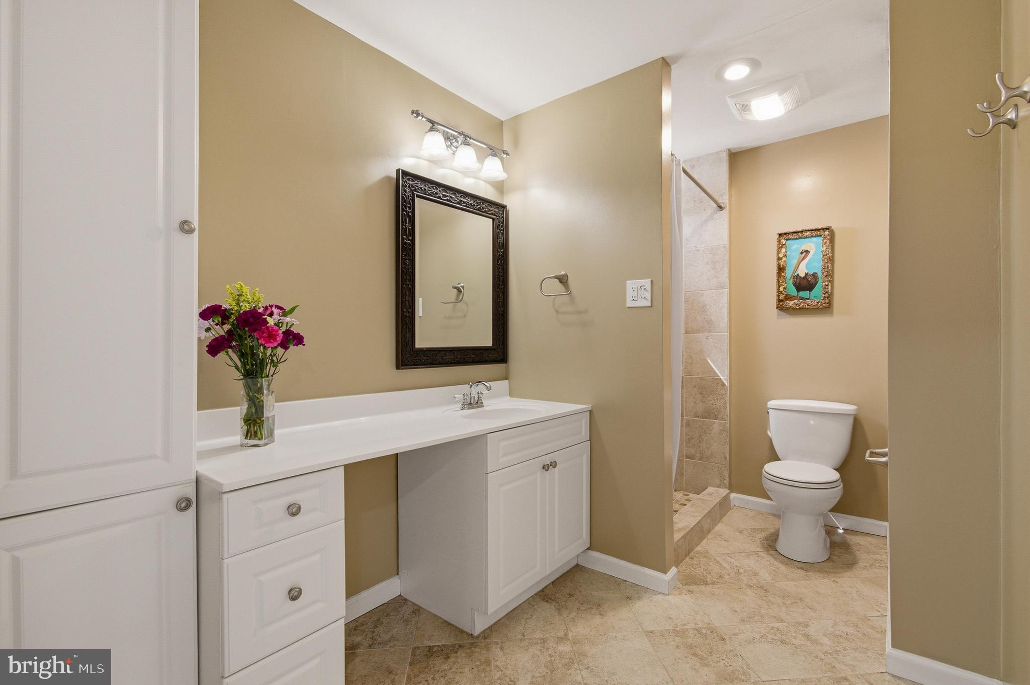 1410 Knights Bridge Turn Crofton, MD 21114 - Photo 35 of 75 a bathroom with a toilet sink and mirror
