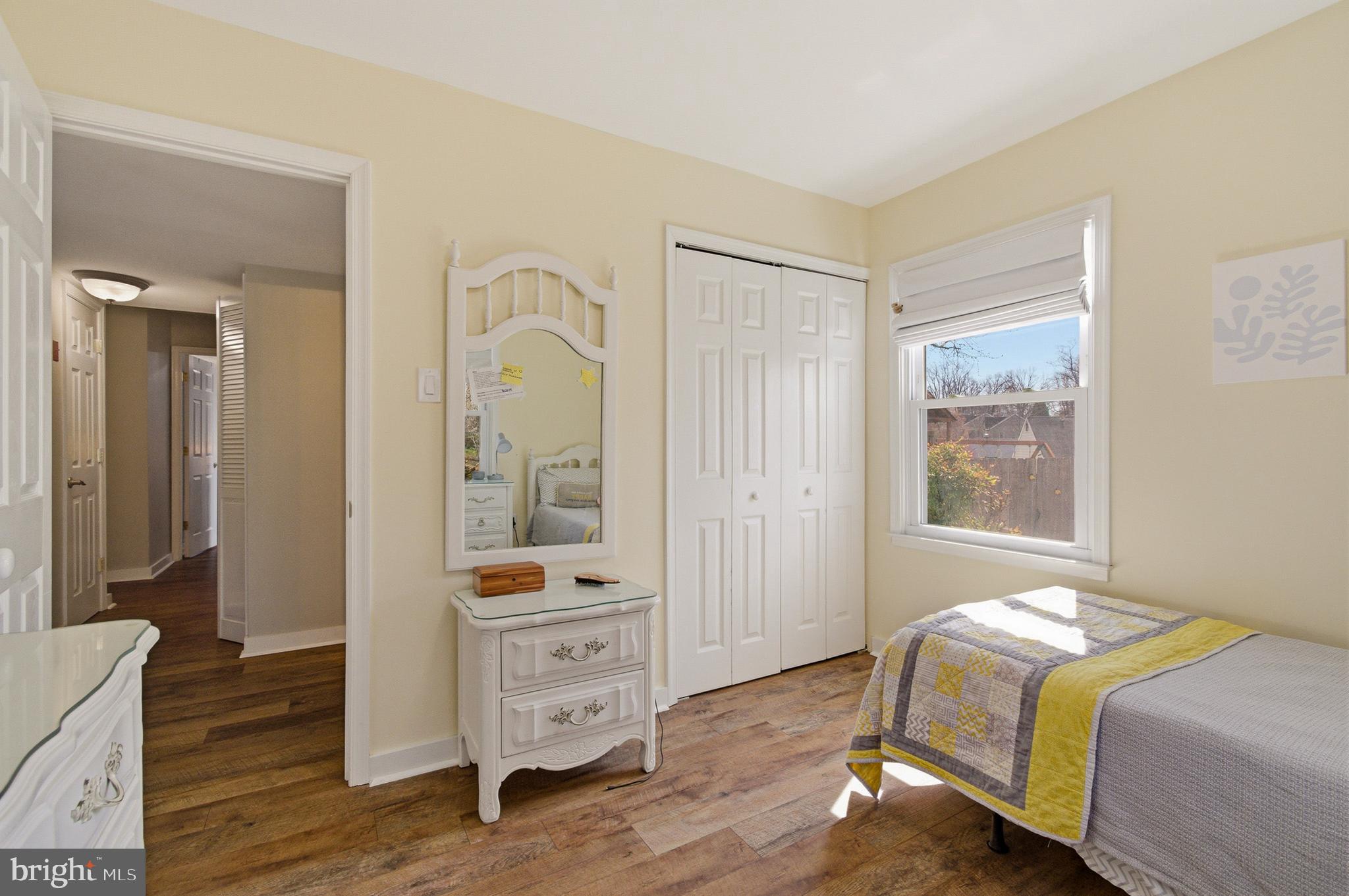 1410 Knights Bridge Turn Crofton, MD 21114 - Photo 38 of 75 a bedroom with a bed and wooden floor