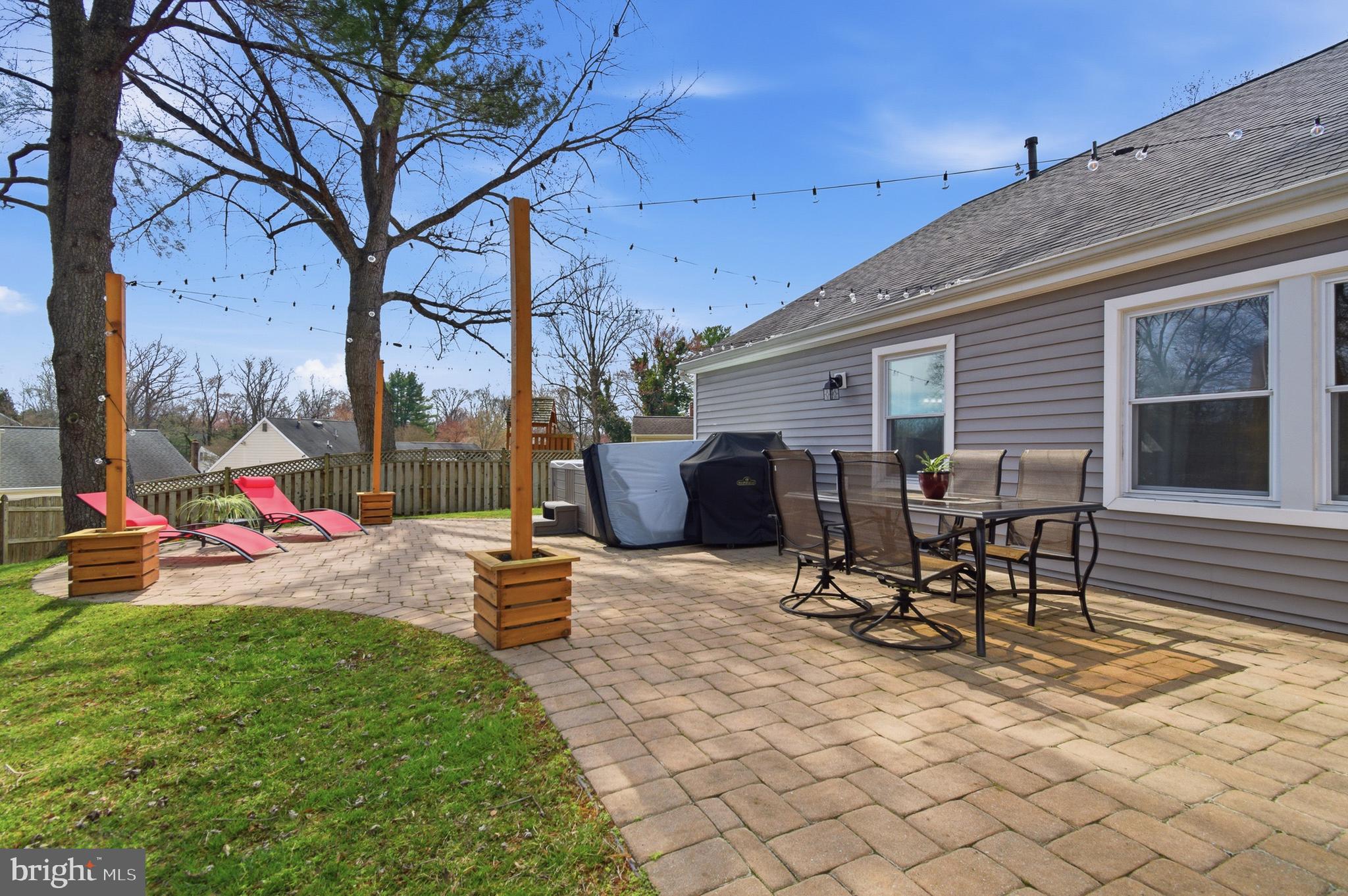 1410 Knights Bridge Turn Crofton, MD 21114 - Photo 46 of 75 a view of a patio with table and chairs and potted plants