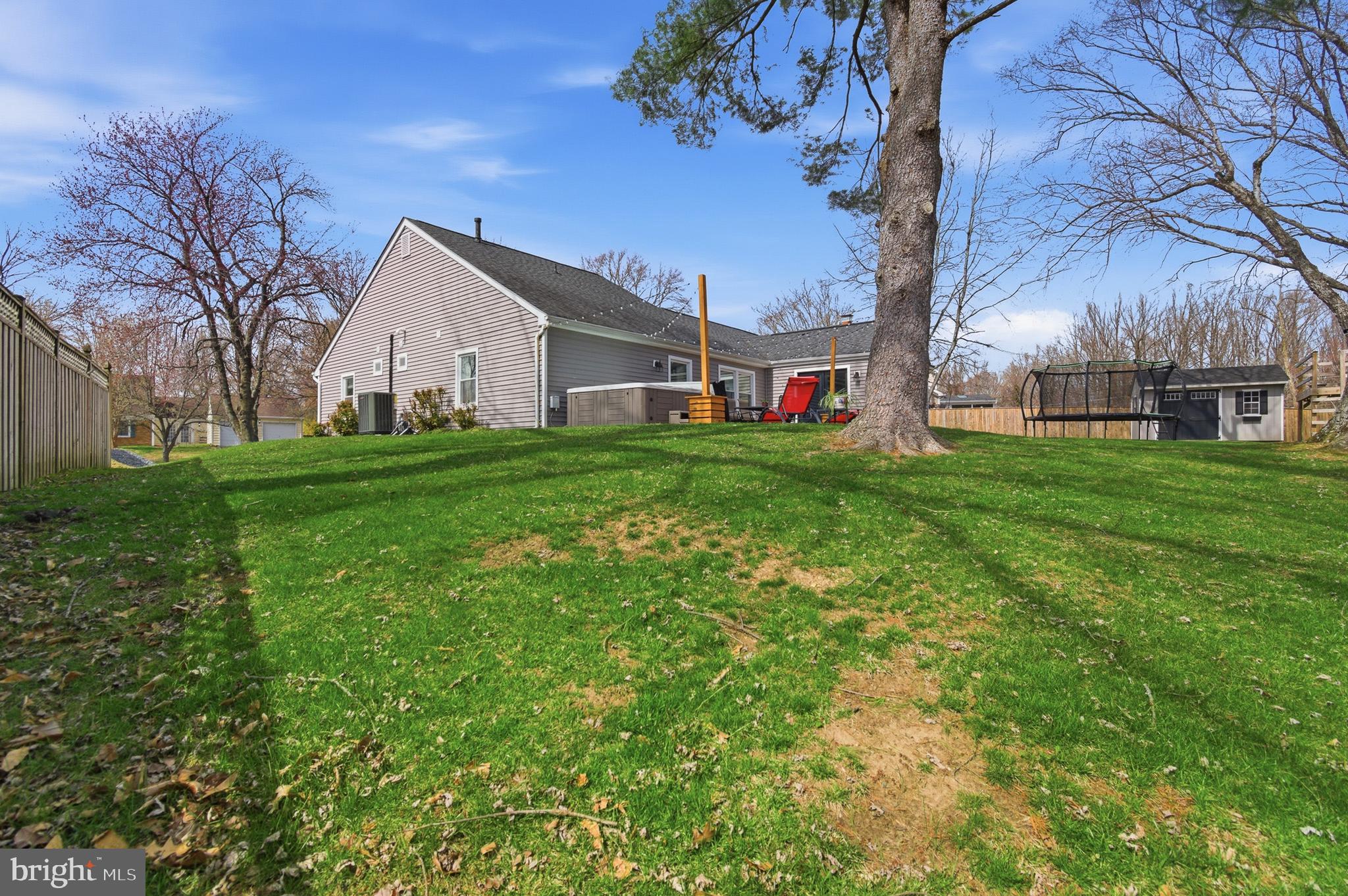 1410 Knights Bridge Turn Crofton, MD 21114 - Photo 56 of 75 a view of a backyard with plants and large trees
