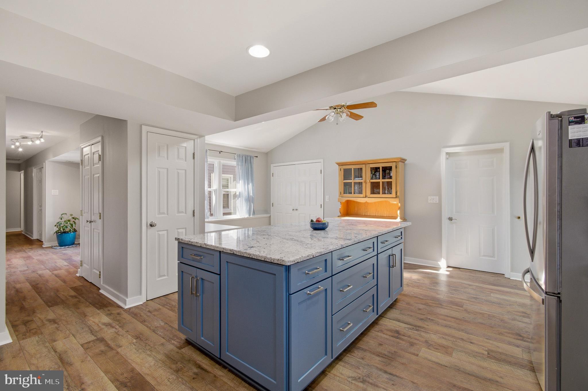 1410 Knights Bridge Turn Crofton, MD 21114 - Photo 8 of 75 a bathroom with a granite countertop sink a mirror and a shower