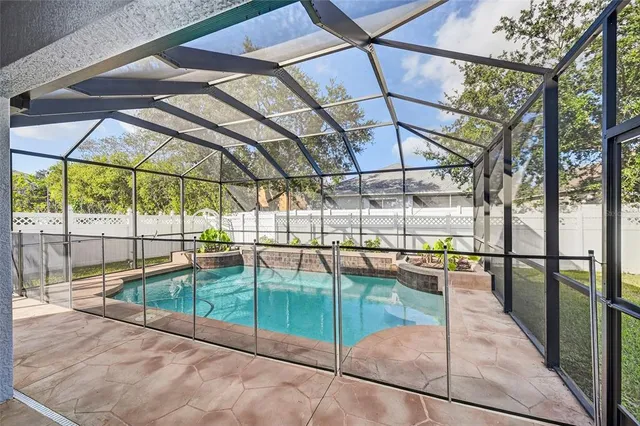 a view of a swimming pool with a patio