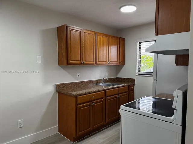 a view of cabinets and window