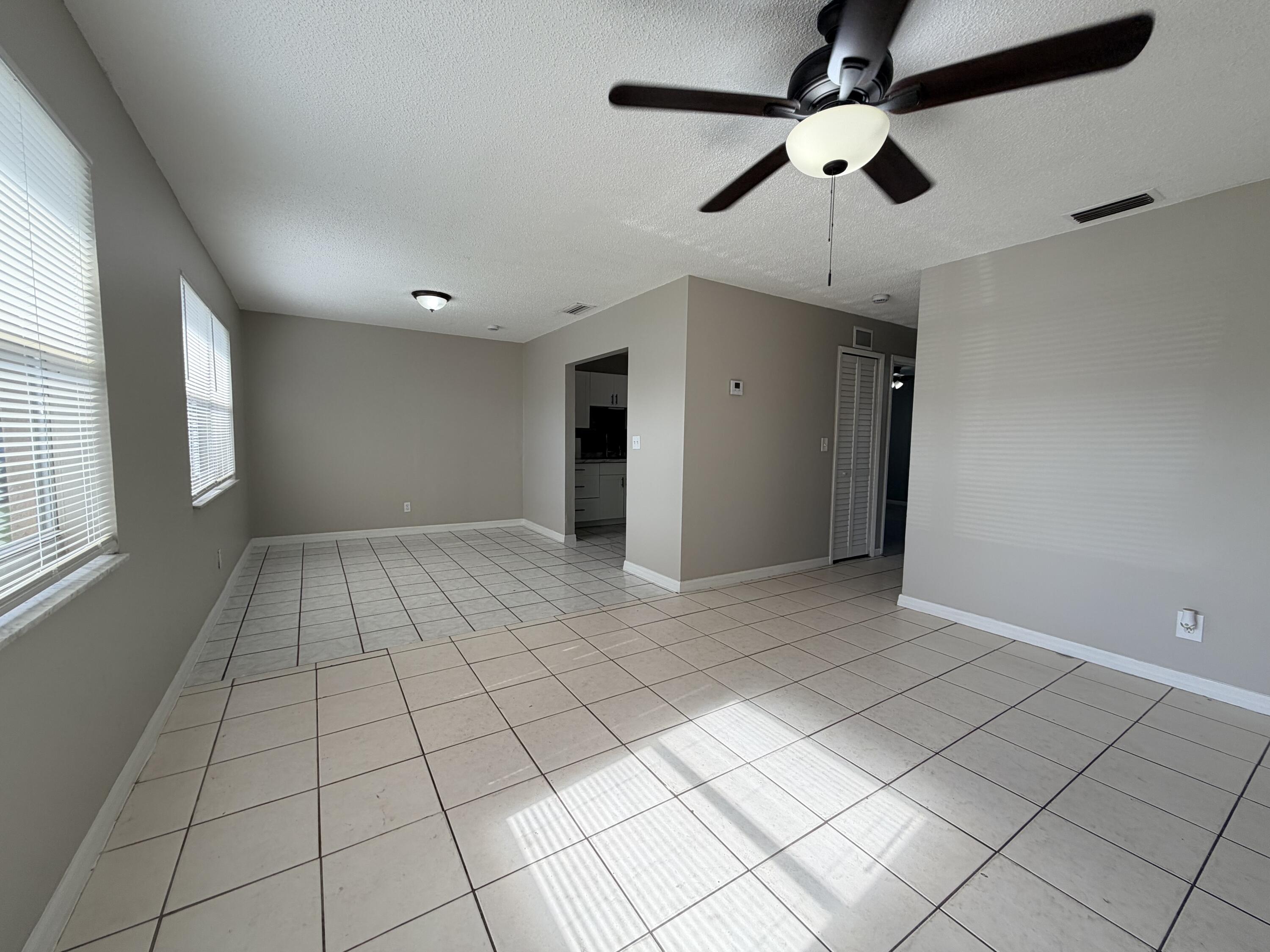 3594 Almar Road, Unit 3 Lake Worth, FL 33461 - Photo 3 of 15 a view of an empty room and window