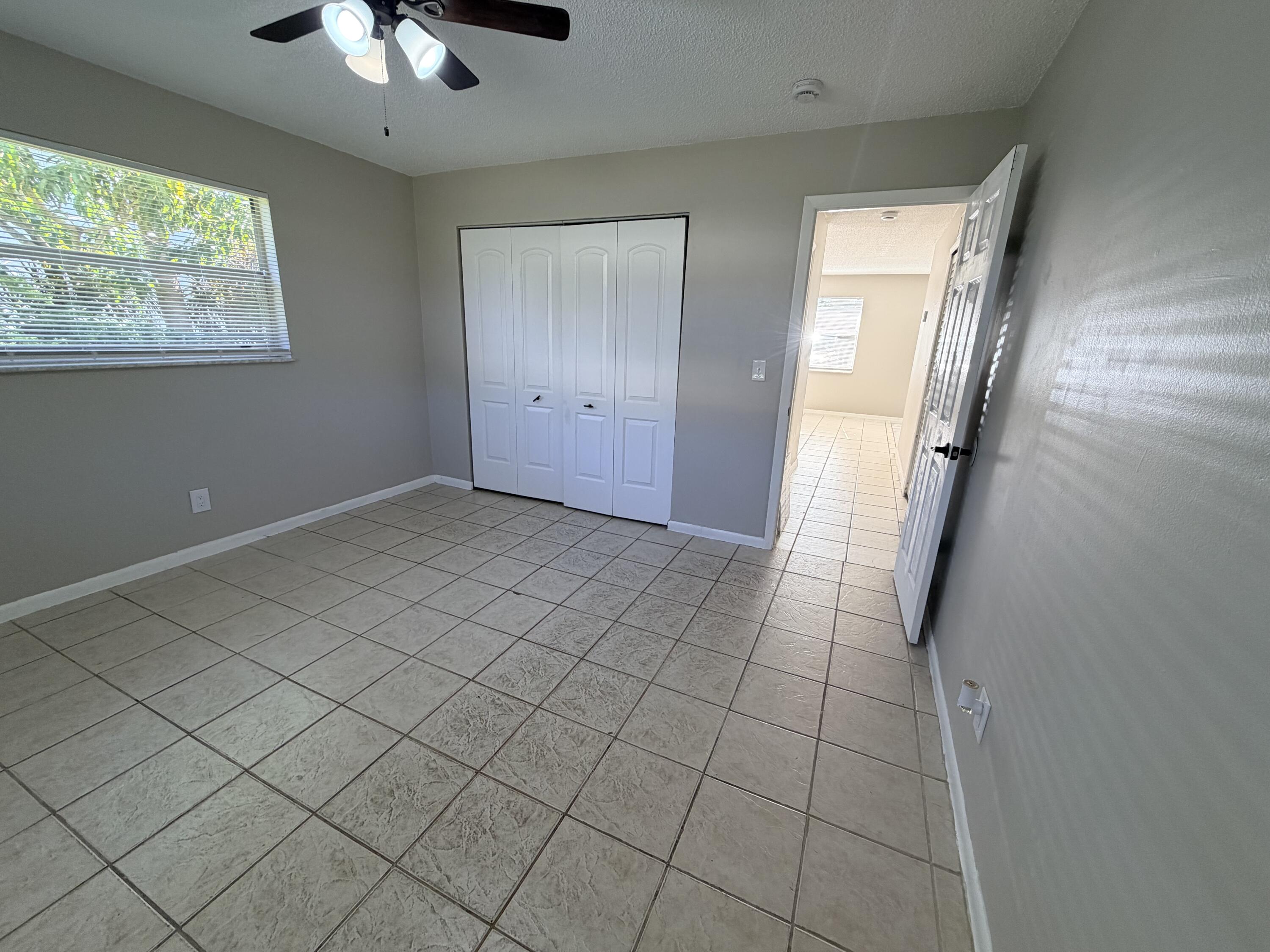 3594 Almar Road, Unit 3 Lake Worth, FL 33461 - Photo 5 of 15 an empty room with windows