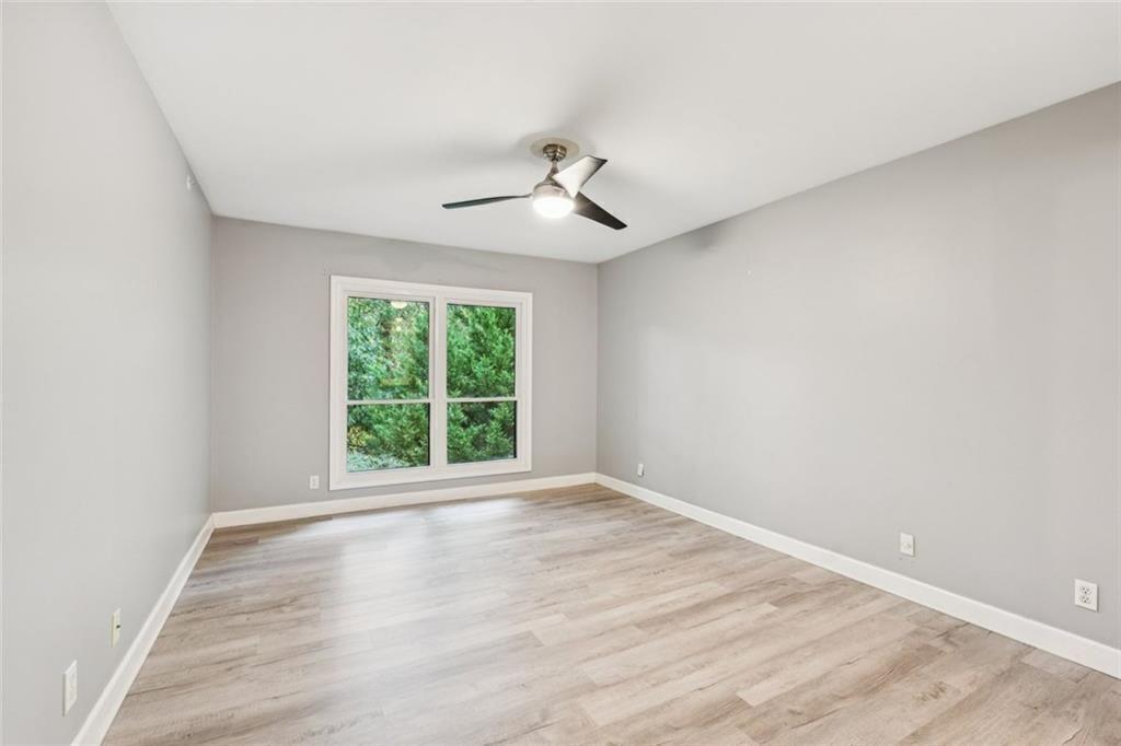 1205 Killarney Southeast Smyrna, GA 30080 - Photo 21 of 58 wooden floor in an empty room with a window