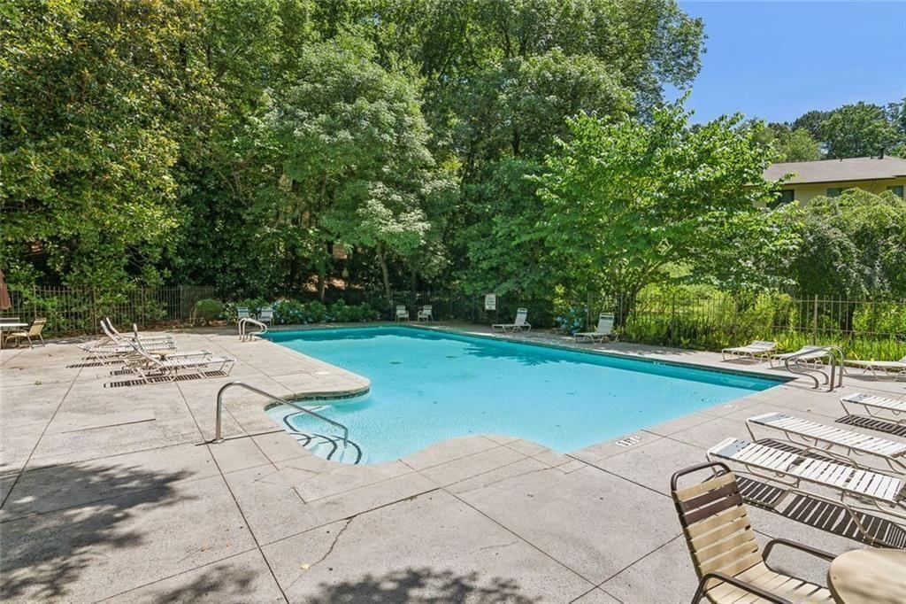 1205 Killarney Southeast Smyrna, GA 30080 - Photo 30 of 58 a view of backyard with a table and chairs