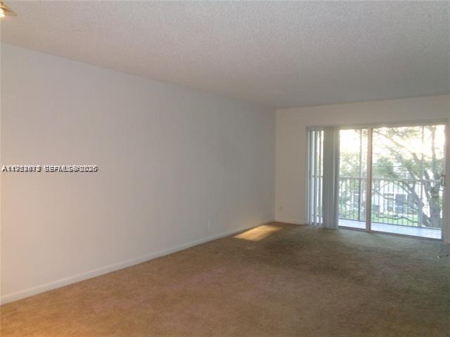 1075 Riverside Drive, Unit 304 Coral Springs, FL 33071 - Photo 4 of 12