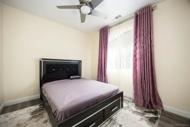 a bathroom with a double vanity sink toilet and shower