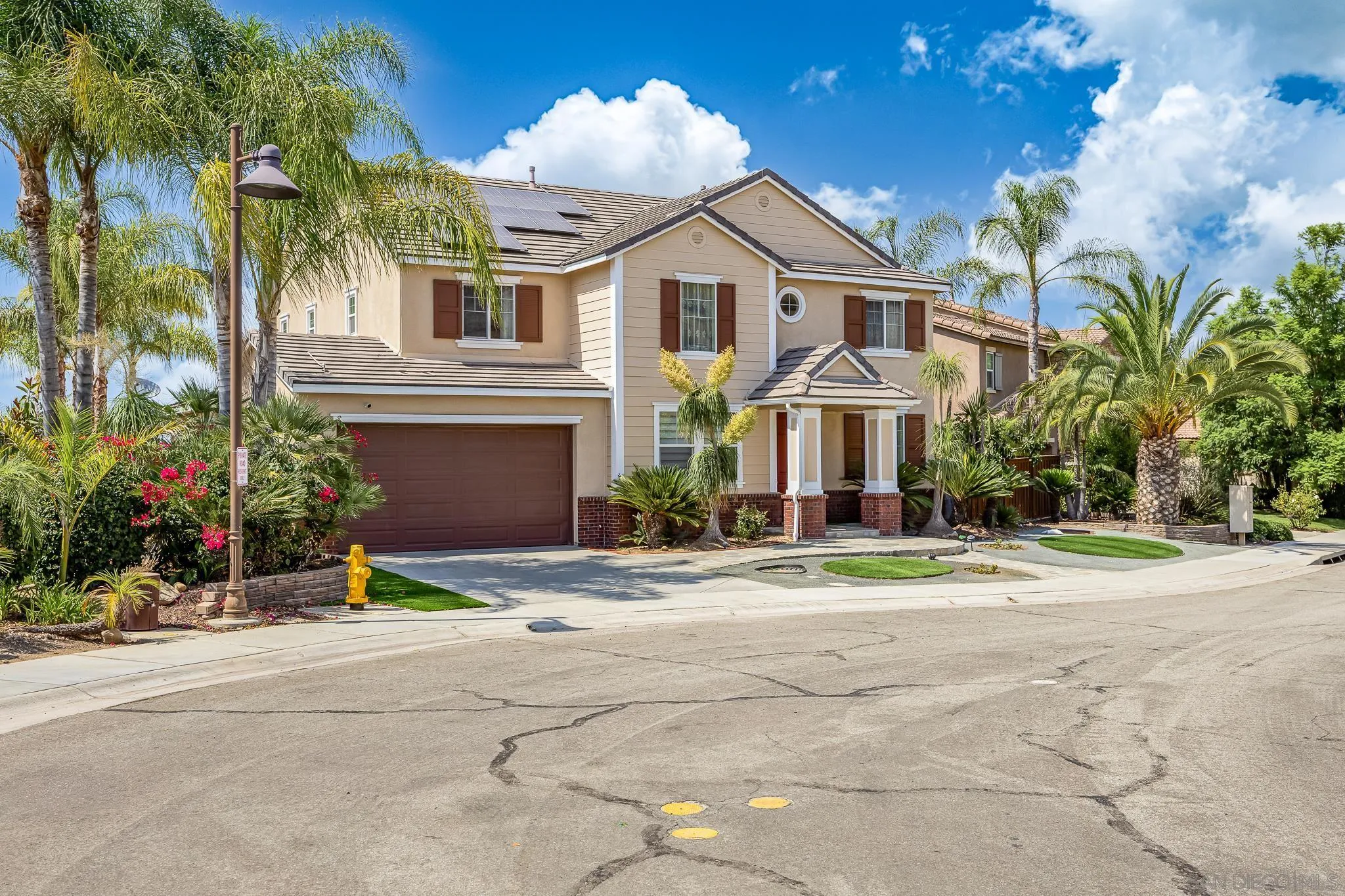 5120 Sevilla Street Santee, CA 92071 - Photo 2 of 44 a front view of a house with a yard and garage