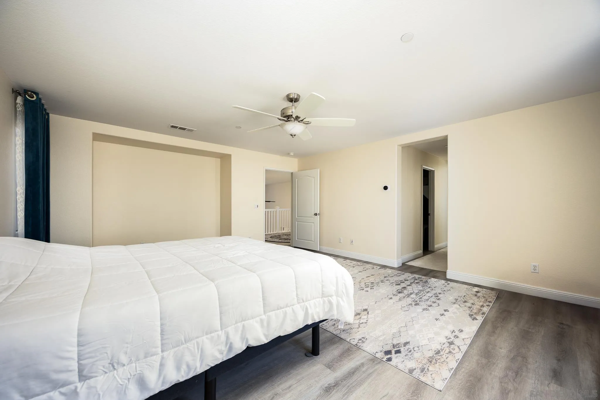 5120 Sevilla Street Santee, CA 92071 - Photo 24 of 44 a large white bed in a white room